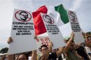 Anti-PRI protesters from opposition movement Yosoy132 hold up signs during a demonstration in Cancun