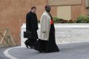 Cardinal Pasinya, of the Democratic Republic of Congo, and Cardinal de Aviz of Brazil arrive for a meeting at the Synod Hall in the Vatican