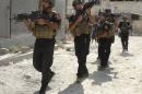 Members of the ISOF conduct a patrol looking for militants of the Islamic State in a neighbourhood in Ramadi