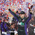 Denny Hamlin celebrates in victory lane after winning the NASCAR Sprint Cup Series auto race at Kansas Speedway in Kansas City, Kan., Sunday, April 22, 2012. (AP Photo/Orlin Wagner)