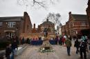 Members of the public queue to view the coffin containing the remains of England's King Richard III outside Leicester Cathedral in Leicestershire, central England, on March 23, 2015