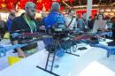 A man looks over a 360Heros drone at the Intel booth during the 2015 International Consumer Electronics Show in Las Vegas