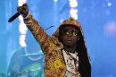 FILE - In this March 1, 2012 file photo, Lil Wayne performs at the Caesars Entertainment "Escape To Total Rewards" concert, in Los Angeles. The multiplatinum rapper was hospitalized on Friday night, March 15, 2013, and reps confirmed he was "recovering." A person close to the superstar rapper's camp who asked for anonymity because of the sensitivity of the matter confirmed to The Associated Press that Lil Wayne had a seizure. (AP Photo/Chris Pizzello, File)