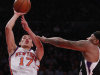 New York Knicks' Jeremy Lin (17) shoots over Sacramento Kings' DeMarcus Cousins during the first half of an NBA basketball game on Wednesday, Feb. 15, 2012, in New York. (AP Photo/Frank Franklin II)