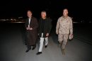 U.S. Secretary of Defense Chuck Hagel walks with Cunningham and Dunford upon his arrival Kabul in Afghanistan
