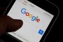 Google signs CBS, in talks with others on web TV: sources
