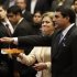 Paraguay's Vice President Federico Franco holds his hand over a bible held by his wife, lawmaker Emila Alfaro, as he is sworn-in as the nation's new president at Congress in Asuncion, Paraguay, Friday, June 22, 2012. Franco was promptly sworn in as president after Paraguay's Senate voted to remove President Fernando Lugo from office in an impeachment trial. (AP Photo/Cesar Olmedo)