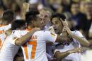 Valencia's Jonas Gonzalves from Brazil, right, and Eduardo Vargas from Chile, left, Jeremy Mathieu from France, center, celebrates after scoring against Sevilla during their Europa League semifinal second leg soccer match at the Mestalla stadium in Valencia, Spain, Thursday, May 1, 2014. (AP Photo/Alberto Saiz)