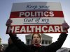 Amy Brighton from Medina, Ohio, who opposes health care reform, rallies in front of the Supreme Court  in Washington, Tuesday, March 27, 2012, as the court continues arguments on the health care law signed by President Barack Obama. (AP Photo/Charles Dharapak)