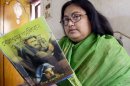 Sushmita Banerjee holds one of her Bengali language novels during press conference in Kolkata, on March 6, 2013