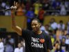 Former NBA basketball player Tracy McGrady of Detroit Pistons gestures to his fans at a stadium during a promotional event of his China tour in Hefei