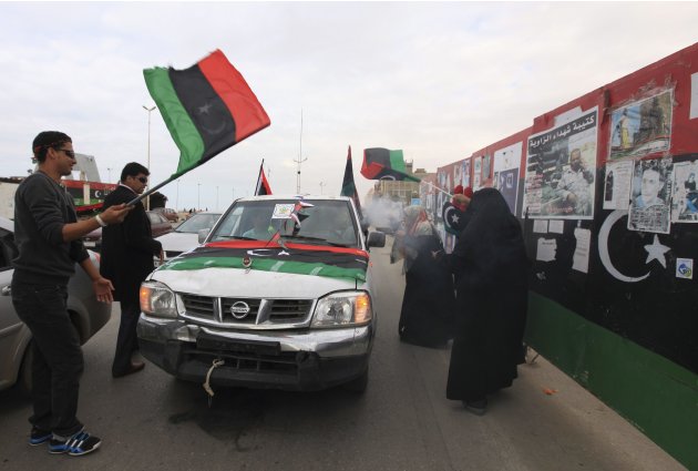 Libyans celebrate after news of Saif al-Islam Gaddafi's arrest, near the courthouse in Benghazi