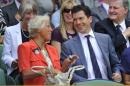Former British tennis players Anne Jones and Tim Henman talk on Centre Court at the 2010 Wimbledon tennis championships in London