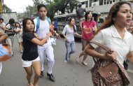 Residents scamper to safety after a 6.8 earthquake that hit Cebu City. Rescuers in the Philippines dug through rubble with shovels and their bare hands Tuesday after a powerful earthquake triggered landslides, collapsed homes and killed dozens of people