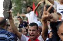 Protesters take part in a demonstration at Tahrir square in Cairo
