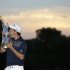 Justin Rose, of England, poses with the trophy after winning the U.S. Open golf tournament at Merion Golf Club, Sunday, June 16, 2013, in Ardmore, Pa. (AP Photo/Julio Cortez)