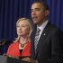U.S. President Barack Obama stands with Secretary of State Hillary Rodham Clinton as he announces that she will travel to Myanmar, on the sidelines of the ASEAN and East Asia summit in Nusa Dua, on the island of Bali, Indonesia, Friday, Nov. 18, 2011. (AP Photo/Charles Dharapak)