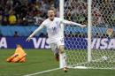 England's Wayne Rooney celebrates after scoring his side's first goal during the group D World Cup soccer match between Uruguay and England at the Itaquerao Stadium in Sao Paulo, Brazil, Thursday, June 19, 2014. (AP Photo/Kirsty Wigglesworth)