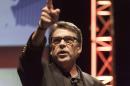 Texas Governor Rick Perry gestures as he speaks at the Family Leadership Summit in Ames