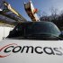FILE - This Feb. 15, 2011 file photo, shows a Comcast logo on a Comcast installation truck in Pittsburgh. Comcast said Wednesday, Nov. 2, 2011, its profit rose 5 percent in the third quarter as revenue at the nation's biggest cable television company climbed 51 percent. (AP Photo/Gene J. Puskar, File)