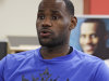 Miami Heat's LeBron James answers questions about his charitable efforts and the NBA lockout, during an interview in Akron, Ohio, Monday, Aug. 8, 2011. (AP Photo/Mark Duncan)