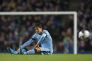 Manchester City's David Silva sits on the pitch after being injured during the English League Cup soccer match between Manchester City and Newcastle at the Etihad Stadium, Manchester, England, Wednesday Oct. 29, 2014. (AP Photo/Jon Super)