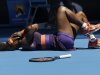 Serena Williams of the US lies on the court after falling during her first round match against Romania's Edina Gallovits-Hall  at the Australian Open tennis championship in Melbourne, Australia, Tuesday, Jan. 15, 2013. (AP Photo/Rob Griffith)