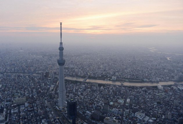 A view of Tokyo Skytree, the world's tallest broadcasting tower at 634 metres (2080 feet), in Tokyo in this photo taken by Kyodo on May 21, 2012. The tower opened to the public on Tuesday, with hundreds of people entering the tower and its large shopping mall. Picture taken May 21, 2012. Mandatory Credit REUTERS/Kyodo (JAPAN - Tags: BUSINESS CONSTRUCTION SOCIETY MEDIA TPX IMAGES OF THE DAY) FOR EDITORIAL USE ONLY. NOT FOR SALE FOR MARKETING OR ADVERTISING CAMPAIGNS. THIS IMAGE HAS BEEN SUPPLIED BY A THIRD PARTY. IT IS DISTRIBUTED, EXACTLY AS RECEIVED BY REUTERS, AS A SERVICE TO CLIENTS. MANDATORY CREDIT. JAPAN OUT. NO COMMERCIAL OR EDITORIAL SALES IN JAPAN. YES