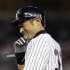 New York Yankees Ichiro Suzuki smiles at first base after driving in the winning run against the Toronto Blue Jays in the eighth-inning of the Yankees' 2-1 victory in Game 2 of a baseball doubleheader at Yankee Stadium in New York, Wednesday, Sept. 19, 2012. (AP Photo/Kathy Willens)