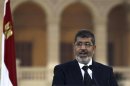 Egyptian President Mohamed Mursi speaks during a news conference with Turkish President Abdullah Gul after their meeting at Presidential Palace "Qasr Al Quba" in Cairo