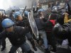 Students clash with police during a demonstration in Milan, Italy, Thursday, Nov. 17, 2011. University students are protesting in Milan and Rome against budget cuts and a lack of jobs, hours before new Italian Premier Mario Monti reveals his anti-crisis strategy in Parliament. Across Italy, transport unions called all-day walkouts or strikes of several hours Thursday to demand better work contracts. Scuffles among students were reported at the start of the demonstration in Milan, where they hoped to march to Bocconi University, which trains Italy's business elite. Monti, an economist, is Bocconi's president and is scheduled to speak in the afternoon ahead of a confidence vote on the government he formed on Wednesday. (AP Photo/Luca Bruno)