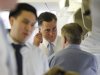 Republican presidential candidate and former Massachusetts Gov. Mitt Romney talks to strategist Stuart Stevens, right, as adviser Lanhee Chen is seen at left as they board their charter plane in Tel Aviv, Israel as they travel to Poland, Monday, July 30, 2012. (AP Photo/Charles Dharapak)