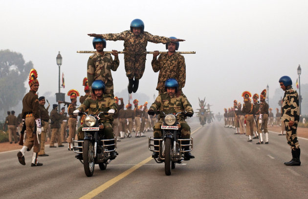 Indian soldiers train on stunt motorcycles in preparation for an upcoming Republic Day parade in New Delhi, India,Friday, Jan. 13, 2012. India marks Republic Day on Jan. 26, 2012.  (AP Photo/Kevin Fra