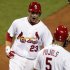 St. Louis Cardinals' David Freese (23) celebrates as he is met at home by Albert Pujols after hitting a three-run home run during the seventh inning of a baseball game against the New York Mets on Wednesday, Sept. 21, 2011, in St. Louis. (AP Photo/Jeff Roberson)