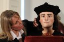 Philippa Langley, originator of the 'Looking for Richard III' project, looks at the facial reconstruction of Richard III, unveiled to the media at the Society of Antiquaries, London, Tuesday Feb. 5, 2013. He was king of England, but for centuries he lay without shroud or coffin in an unknown grave, and his name became a byword for villainy. On Monday, scientists announced they had rescued the remains of Richard III from anonymity — and the monarch's fans hope a revival of his reputation will soon follow. (AP Photo/PA, Gareth Fuller) UNITED KINGDOM OUT NO SALES NO ARCHIVE