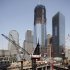 Work continues on the foundation for Two World Trade Center, foreground, and One World Trade Center, rear, Tuesday, Aug. 2, 2011, in New York. About 200 laborers stood down from their jobs for a second day Tuesday at the World Trade Center site, although the owner said the work stoppage had a minimal impact on the site's transit hub and signature skyscraper, and no impact on the memorial. (AP Photo/Mark Lennihan)