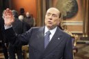 Former Italian Prime Minister Silvio Berlusconi gestures before the taping of the talk show "Telecamere" at Rai television in Rome