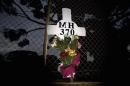 A memorial cross and wreath in memory of the victims of missing Malaysia Airways Flight MH370 is pictured outside RAAF Base Pearce in Bullsbrook