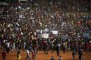 Protesters arrive during a protest over planned increases in tuition fees outside the Union building in Pretoria