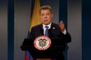 Colombia's President Santos talks during a news conference after a meeting with Colombian former President and Senator Uribe at Narino Palace in Bogota