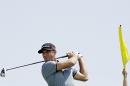Dustin Johnson hits on the 11th hole during a practice round for the PGA Championship golf tournament Tuesday, Aug. 11, 2015, at Whistling Straits in Haven, Wis. (AP Photo/Brynn Anderson)