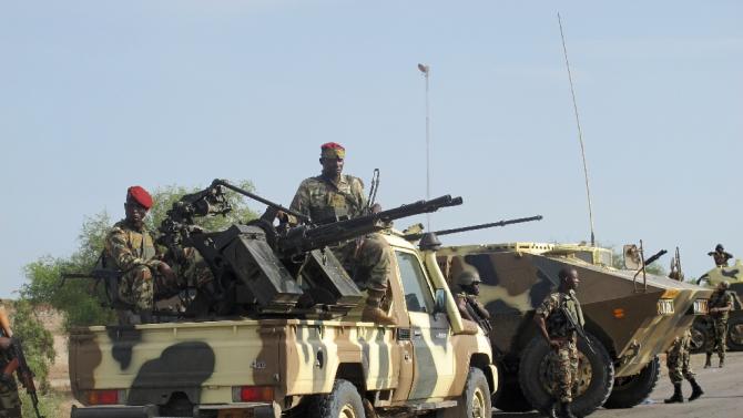 A convoy of Cameroon soldiers passes through the northern town of Dabanga as part of a reinforcement of its military forces against Nigerian Islamist group Boko Haram in June 2014