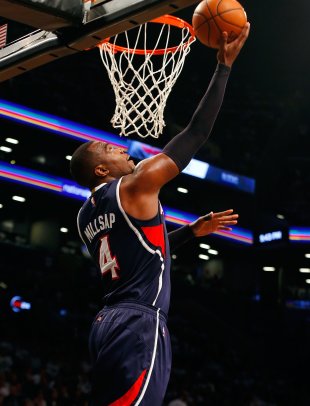 NEW YORK, NY - MAY 01:  Paul Millsap #4 of the Atlanta Hawks lays up a basket in the second half against the Brooklyn Nets during game six in the firs...