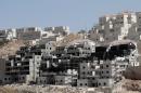 Buildings under construction are seen in the Israeli settlement of Beitar Illit near the Palestinian West Bank village of Wadi Fukin, on September 4, 2014