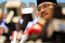 Malaysian Transport Minister Hishammuddin Hussein listens to reporter's questions about the missing Malaysia Airlines flight MH370, at Kuala Lumpur International Airport March 21, 2014. REUTERS/Damir Sagolj
