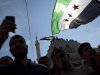 Men hold revolutionary Syrian flags during an  anti government protest in a town in north Syria, Friday, March 2, 2012. Syria has faced mounting international criticism over its bloody crackdown on the uprising, which started with peaceful protests but has become increasingly militarized. (AP Photo/Rodrigo Abd)