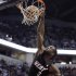 Miami Heat guard Dwyane Wade gets a bucket on a dunk in the first half of an NBA basketball game against the Indiana Pacers in Indianapolis, Tuesday, Feb. 14, 2012.  (AP Photo/Michael Conroy)