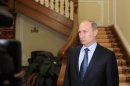 Russia's President Vladimir Putin makes a statement on issues connected with chemical weapons in Syria at the Novo-Ogaryovo residence outside Moscow