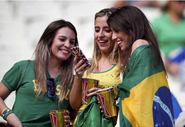 Fans of Brazil wait for the start of the Confederations Cup Group A soccer match between Brazil and Mexico at the Estadio Castelao in Fortaleza
