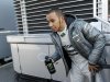 Mercedes Formula One driver Hamilton of Britain walks by the paddock during a training session at Circuit de Catalunya racetrack in Montmelo